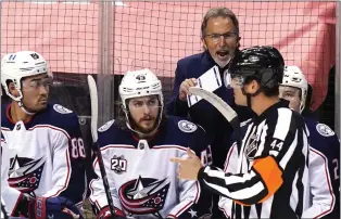  ?? LYNNE SLADKY — THE ASSOCIATED PRESS ?? Columbus coach John Tortorella, center, has a few choice words for an official after a fight between Gavin Bayreuther of the Blue Jackets and Florida’s Sam Bennett during a game in 2021. The fiery Tortorella could be introduced Friday as the Flyers’ next head coach.