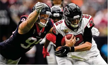  ?? MARK BROWN / GETTY IMAGES ?? Falcons quarterbac­k Matt Ryan, being tackled by Texans defensive lineman J.J. Watt in Sunday’s loss, probably needs to get the offense off to better starts to help his struggling defense.