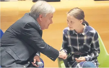  ?? REUTERS ?? Secretary-General of the United Nations Antonio Guterres shakes hands with Swedish environmen­tal activist Greta Thunberg at the Youth Climate Summit at United Nations Headquarte­rs in New York on Saturday.