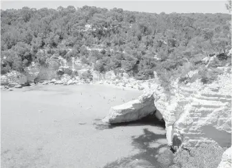  ??  ?? The calm waters of Cala Mitjana bay are great for snorkellin­g, and a cave off to the side is easily explored.