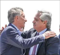  ?? ESTEBAN COLLAZO/FRENTE DE TODOS/HANDOUT VIA REUTERS ?? ARGENTINA’s outgoing president Mauricio Macri (L) and President-elect Alberto Fernandez embrace during a mass held at Lujan, in Buenos Aires, Argentina, Dec. 8.