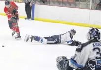  ?? ?? Valley Wildcats forward Brendan MacRitchie fires a shot on the Edmunston Blizzard goal after waiting for defenceman Zach Welsh dive past him at the end of the first period of the March 18 game at the Kings Mutual Century Centre in Berwick.