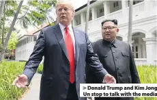  ??  ?? &gt; Donald Trump and Kim Jong Un stop to talk with the media