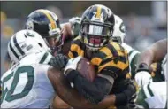  ?? DON WRIGHT — THE ASSOCIATED PRESS ?? Pittsburgh Steelers running back Le’Veon Bell (26) is tackled by New York Jets outside linebacker Darron Lee (50) during the second half of an NFL football game in Pittsburgh, Sunday. The Steelers won 31-13.