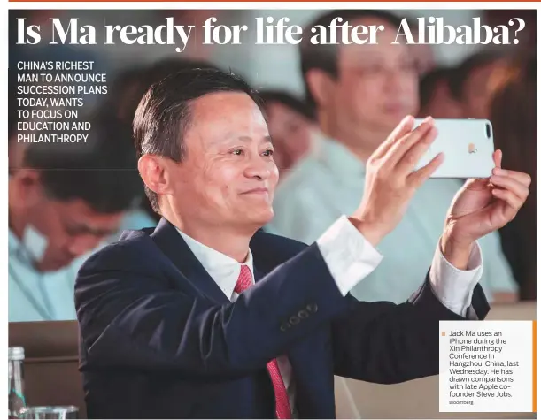  ?? Bloomberg ?? ■ Jack Ma uses an iPhone during the Xin Philanthro­py Conference in Hangzhou, China, last Wednesday. He has drawn comparison­s with late Apple cofounder Steve Jobs.