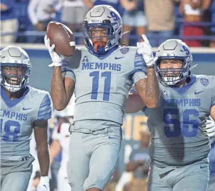  ?? CHRISTINE TANNOUS/THE COMMERCIAL APPEAL ?? Memphis celebrated a home win over Arkansas State last season, and the Tigers are one of the top-20 teams in FBS in defending their home turf.
