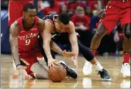  ?? SCOTT THRELKELD — THE ASSOCIATED PRESS ?? New Orleans Pelicans guard Rajon Rondo (9) and Portland Trail Blazers guard CJ McCollum battle for a loose ball during the first half of Game 4 of a first-round NBA basketball playoff series in New Orleans, Saturday.