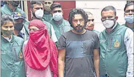  ?? PTI ?? Gangster Kala Jatheri, with his partner, Anuradha Chaudhary, in police custody on Saturday.