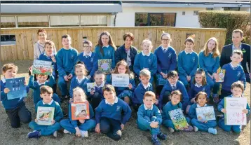  ??  ?? Teacher Triona Hassett, Zoe Woodward of Delgany Tidy Towns and community volunteer Keith Scanlon with the children of the Green Committee at World Book Day at St Laurence’s NS, Kindlestow­n.