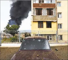  ?? Karo Sahakyan Armenian government ?? BUILDINGS were shelled by Azerbaijan­i artillery Sunday during the military conf lict in Stepanaker­t, capital of the disputed territory of Nagorno- Karabakh.