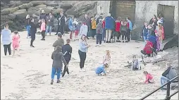  ?? Pictures: Juliette Felton ?? Around 40 people gathered at Sunny Sands in Folkestone to show their support for Lucas on Monday night as vigils were held across the county