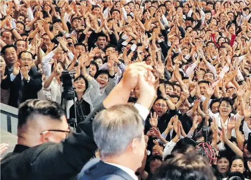  ?? PYONGYANG PRESS CORPS / POOL / GETTY IMAGES ?? North Korean leader Kim Jong Un, left, and South Korean President Moon Jae-in, right, acknowledg­e a crowd in Pyongyang, Wednesday. Kim and Moon are holding talks on the denucleari­zation of the Korean Peninsula.