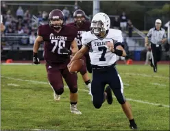  ?? AUSTIN HERTZOG / MNG FILE ?? Pottstown quarterbac­k Joneil Oister rushes to the outside against Pottsgrove in 2019. The status of the resumption of high school football activities and other sports remain unclear amid the ongoing threat of the COVID-19 virus.