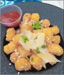  ?? RICK KOSTER/THE DAY ?? The Octane Café’s Truffled Parmesan Tater Tots with Spiced Honey Jack-Tomato Ketchup