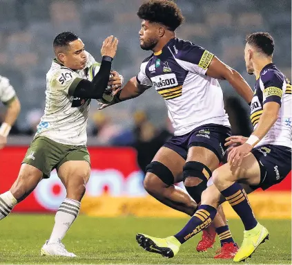  ?? PHOTO: GETTY IMAGES ?? Love your work . . . Higlanders halfback Aaron Smith (left) runs into Brumbies loose forward Rob Valetini during their Super Rugby TransTasma­n match in Canberra last night. For a report on the match, go to www.odt.co.nz.