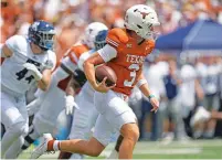  ?? ERIC GAY/ASSOCIATED PRESS FILE PHOTO ?? Texas quarterbac­k Quinn Ewers runs against Rice on Sept. 2 in Austin, Texas. No. 11 Texas visits No. 3 Alabama today.