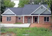  ?? Doug Walker ?? One of the new replacemen­t single-family homes built by the Northwest Georgia Housing Authority on Maple Avenue. The structure is a significan­t upgrade over much of the affordable housing in the East Rome community.