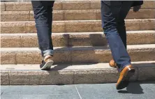  ?? Photos by Stephen Lam / Special to The Chronicle ?? Top: Style reporter Tony Bravo (right) and David Kahan, CEO of Birkenstoc­k USA, chat as they stroll through Yerba Buena Gardens.