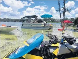  ?? COURTESY OF JOEY NERO ?? The 10-acre Egret Island in Lake Butler lures pelicans, partiers and personal watercraft on weekends and holidays, much to the chagrin of some nearby residents in Windermere.