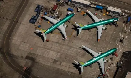  ?? Photograph: Gary He/EPA ?? Boeing 737 Max 8 aircraft in production sit parked at the Boeing factory in Renton, Washington, on 21 July 2019.