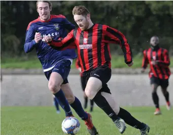  ??  ?? Carbury’s Niall Brennan tries to get away from Glenview’s Clive Brennan.