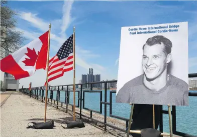  ?? DAVE CHIDLEY / THE CANADIAN PRESS ?? A photo of hockey great Gordie Howe on the Detroit River waterfront in Windsor at the 2015 announceme­nt that the Detroit River Internatio­nal Crossing will be named the Gordie Howe Internatio­nal Bridge.