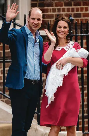  ??  ?? Prince William, Duke of Cambridge and Catherine, Duchess of Cambridge, pose for photograph­ers with their newborn baby boy outside St Mary’s Hospital in London.