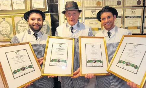  ??  ?? Prime performers Owner Graeme Johnston (centre) and his terrific team display the business’ latest awards