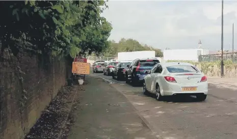  ??  ?? The queue at the Household Waste and Recycling Centre when it reopened for the first time since lockdown.