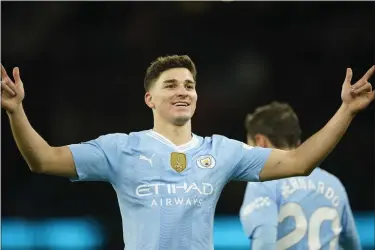  ?? AP PHOTO/DAVE THOMPSON ?? Manchester City’s Julian Alvarez celebrates after scoring his side’s second goal during the English Premier League soccer match between Manchester City and Sheffield United at the Etihad stadium in Manchester, England, Saturday, Dec. 30, 2023.