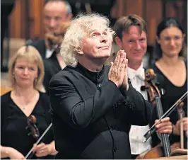  ??  ?? ‘A bold programme, fabulously played’: Sir Simon Rattle takes the applause after conducting his first concert as Music Director of the London Symphony Orchestra at the Barbican