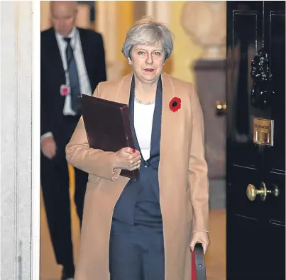  ?? Picture: PA. ?? Prime Minister Theresa May leaves Downing Street ahead of the party leaders’ meeting.
