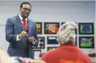  ?? STAFF PHOTO BY C.B. SCHMELTER ?? Superinten­dent finalist Timothy Gadson III answers a question from Everlena Holmes, right, during a public meet-and-greet at Hamilton County Schools central office on Wednesday.