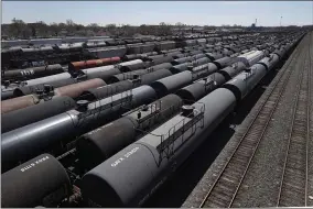  ?? CHARLES REX ARBOGAST ?? Oil tank train cars sit idle Tuesday, April 21, 2020, in East Chicago, Ind. The world is awash in oil, there’s little demand for it and we’re running out of places to put it. That in a nutshell explains this week’s strange and unpreceden­ted action in the market for crude oil futures contracts, where traders essentiall­y offered to pay someone else to deal with the oil they were due to have delivered next month.