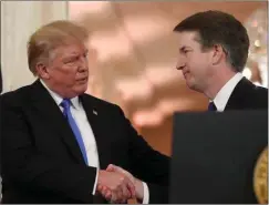  ?? President Trump shakes hands with successful Supreme Court nominee, Brett Kavanaugh ??