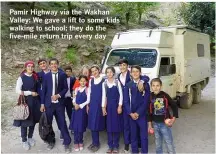  ??  ?? Pamir Highway via the Wakhan Valley: We gave a lift to some kids walking to school; they do the five-mile return trip every day