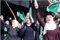  ?? Reuters ?? Palestinia­n women take part in a rally marking the 31st anniversar­y of Hamas’ founding, in Nablus in the Israeli-occupied West Bank on Friday.