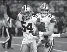  ?? AP/RON JENKINS ?? Jaylon Smith (54) and Tyrone Crawford celebrate Dallas’ victory Saturday over Seattle. The Cowboys now travel to Los Angeles to face the Rams.