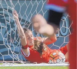  ?? GREG SORBER/JOURNAL ?? Lobo Emily Chavez is tangled in the net after trying to block a kick by Air Force during Sunday’s match at the UNM Soccer Complex. Air Force won 2-1