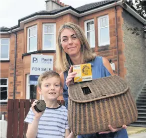  ??  ?? A reel find Angela Hamilton and son Daniel with Johnny’s fishing kit