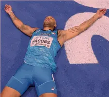  ?? GETTY ?? Incredulo Marcell Jacobs a terra supino dopo l’esito del fotofinish