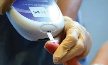  ?? ?? A nurse gives a patient a diabetes test. The research was conducted among 66,569 diabetics in Sweden. Photograph: Peter Byrne/PA