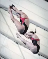  ?? JEFF MCINTOSH
THE CANADIAN PRESS ?? Three-time Olympic medallist Meaghan Benfeito, left, and Caeli McKay practice for the upcoming Canada Cup FINA Diving Grand Prix in Calgary.