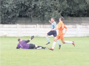  ?? Paul Watson ?? Tom Rowlands makes the game safe for Runcorn Town as he adds a second goal late on against AFC Blackpool on Saturday.