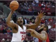  ?? PAUL VERNON — ASSOCIATED PRESS ?? Ohio State’s Kaleb Wesson, left, goes up for a shot against Radford’s Darius Bolstad during the first half.