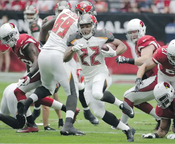  ?? RICK SCUTERI/AP ?? Buccaneers running back Doug Martin, banned from the first three games for using performanc­e-enhancing drugs, creates a difficult decision for a late-round draft pick.