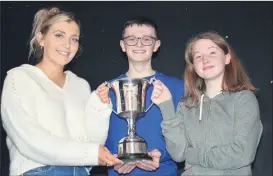  ?? (Pic: John Ahern) ?? BEST OVERALL CLUB: Alan Whelan presenting the Casey/Buckley Cup to St. Catherine’s representa­tives, Maria Joyce and Willow O’Gorman at last Sunday’s Imokilly Scór na bPáistí finals in Watergrass­hill.