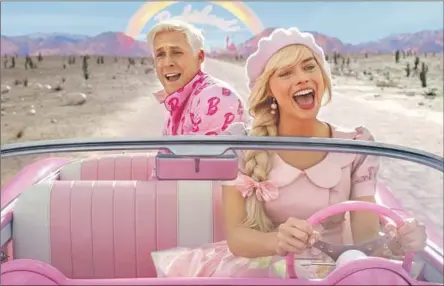  ?? Warner Bros. Pictures ?? KEN (Ryan Gosling) and Barbie (Margot Robbie) go for a joyful spin in the film “Barbie,” which had a mind-blowing opening weekend.