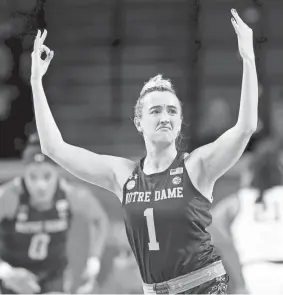  ?? SARAH PHIPPS/THE OKLAHOMAN / USA TODAY NETWORK ?? Notre Dame's Dara Mabrey (1) celebrates a 3-point basket against Oklahoma.