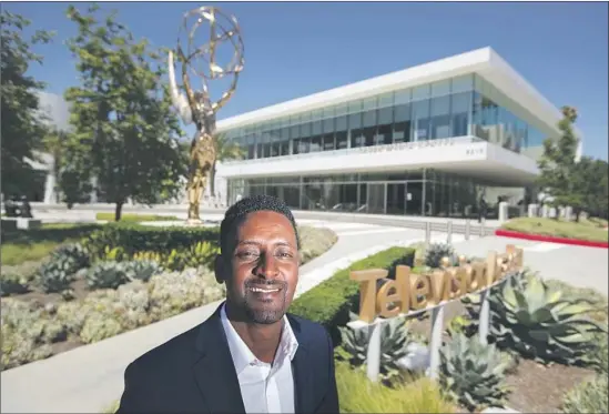  ?? Allen J. Schaben Los Angeles Times ?? ONETIME Ethiopian refugee Azi Hussen, 29, survived a turbulent childhood and is now an intern with the Television Academy Foundation in North Hollywood.